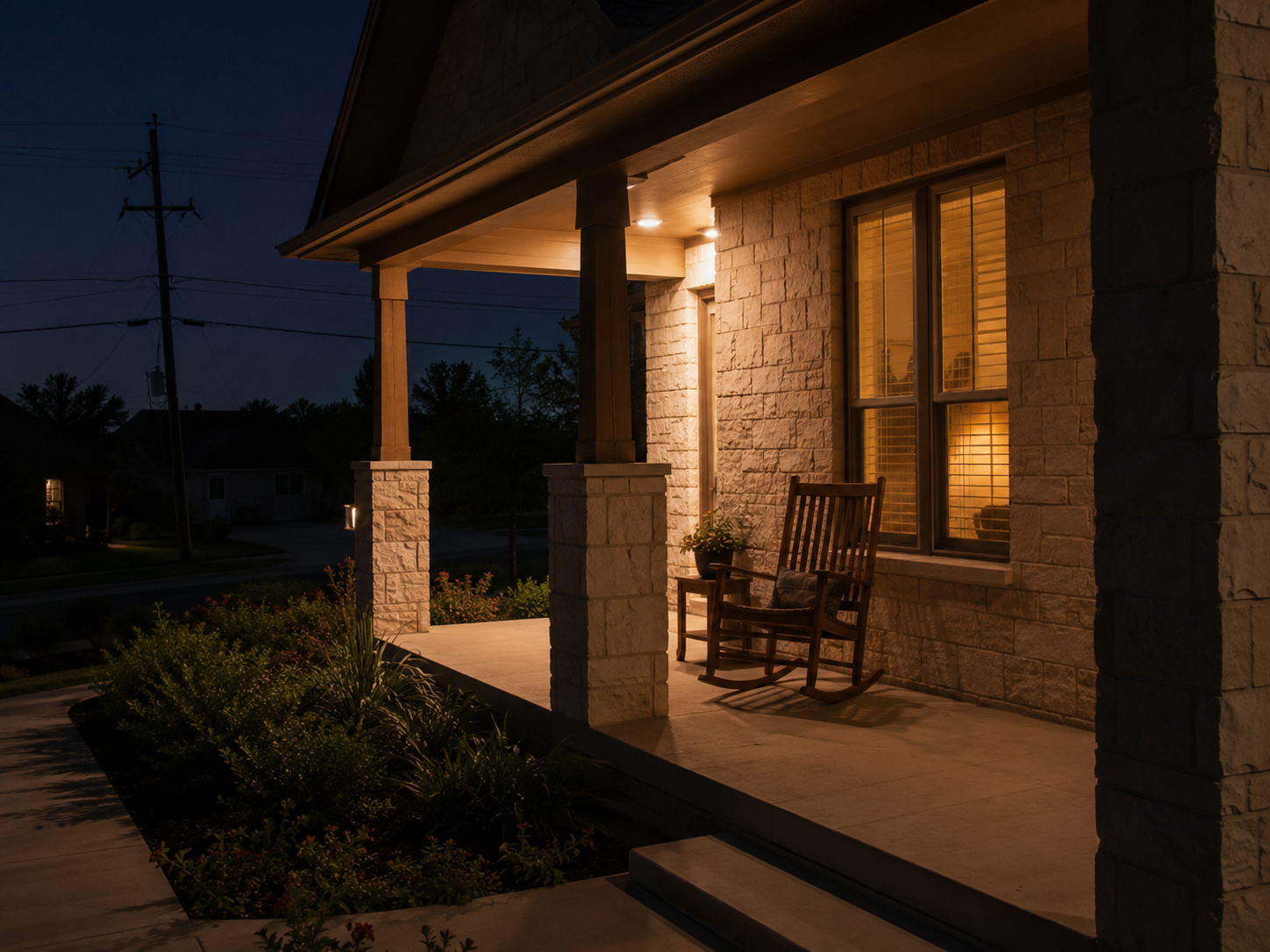 Texas stone home with warm porch lights during a neighborhood power outage